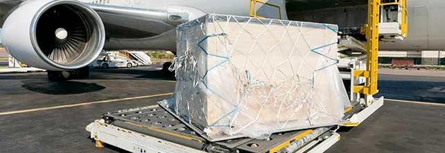 Air cargo being loaded beside an aircraft
