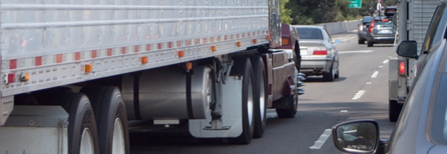 Freight truck travelling on a busy road